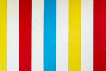 Wooden background in colored stripes