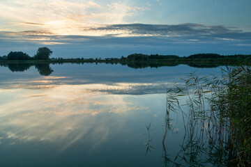 The reflection of the sky in a calm lake