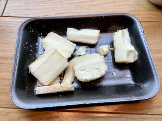 Traditional Moldy Cheese Slices in Plastic Container Package.