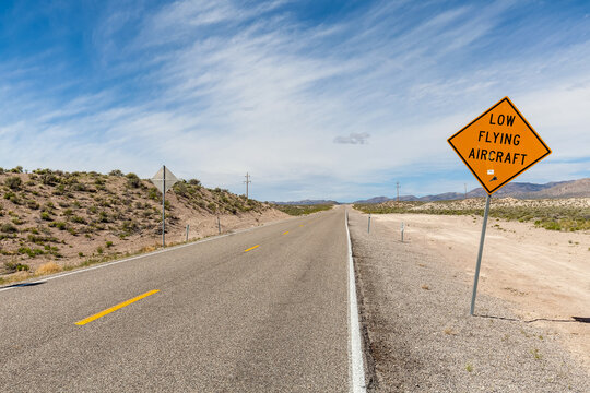Driving along the 375 - Extraterrestrial Highway there are warning signs alerting drivers to the possibility of low flying aircraft, these would be out of the Groom Lake Military base.