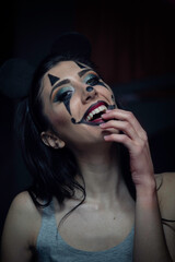 Girl with scary killer clown makeup to celebrate halloween