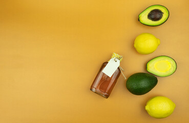 Avocado and oil in a glass bottle