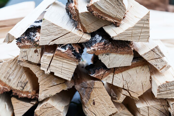 A stack of chopped wood to start a fire before the winter season. Dried wood pallets with textured wood for barbecuing or lighting a fire.