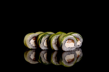 Fresh delicious beautiful sushi rolls on a dark background
