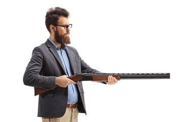 Bearded man aiming with a shotgun - obrazy, fototapety, plakaty
