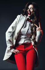Fototapeta premium Funny woman in white coat and red pants