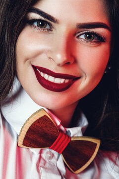 Portrait Of Smiling Woman With Dark Red Lips