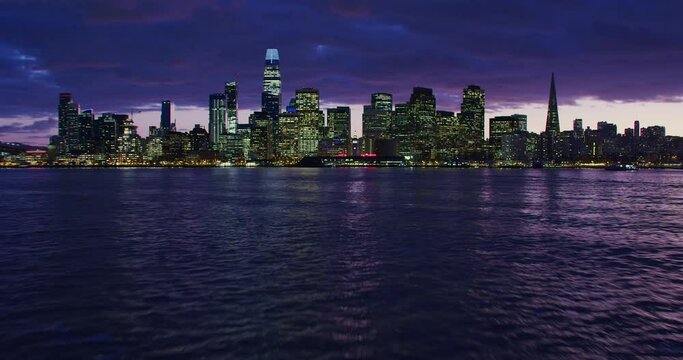 Great aerial view of San Francisco skyscrapers. City skyline and piers. Fly over The Pacific Ocean. California, United States. Shot on Red weapon 8K.