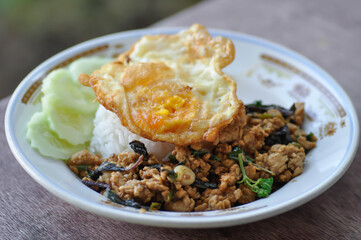 stir fried pork with chili paste, holy basil and fried egg