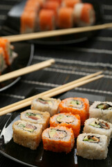 Japanese sushi on black plate