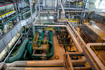 Fototapeta premium Interior of urban thermal power plant, industrial turbines, pipes