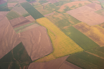 Airplane view of European agricultural fields during summer