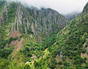 Fototapeta na wymiar View of valley with craggy mountains near Pola de Somiedo Village, Somiedo nature reserve, spain