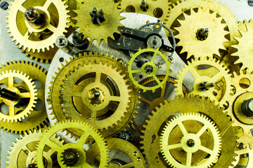 Bronze gears of the old mechanism as a background.