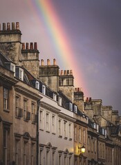 Fototapeta na wymiar Background with rainbow over the buildings of Bath in the united kingdom.