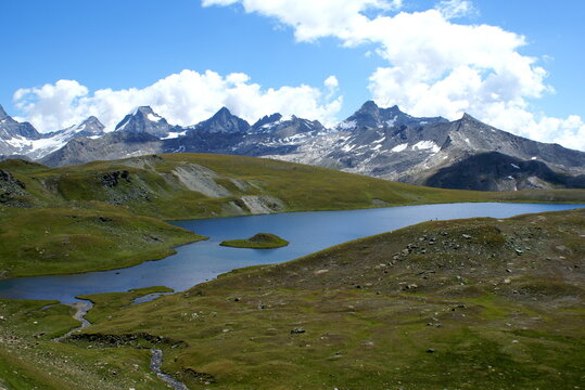 Colle del Nivolet, Italy: panorama with mountains and lake