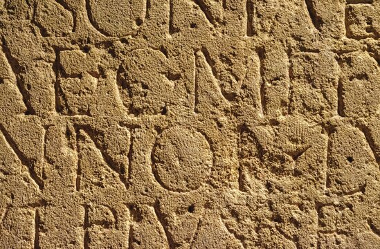 Roman Inscription In Brown Stone In Bath, United Kingdom