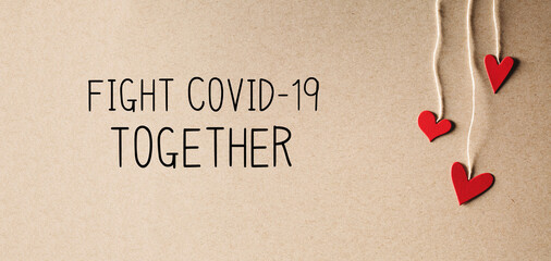 Fight Covid-19 Together message with handmade small paper hearts