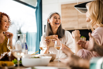 Happy pretty lady looking at her female friend