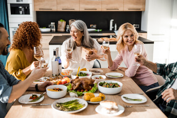 Pretty adult woman having fun with her friends