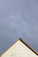  generic gable of a family house with clouds
