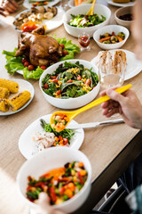 Many dishes with delicious food on a festive table