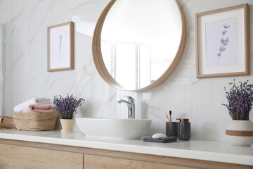 Mirror and counter with vessel sink in bathroom interior. Idea for design