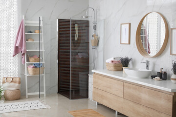 Bathroom interior with shower stall, counter and shelving unit. Idea for design