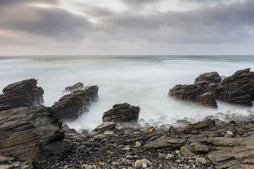 Fototapeta na wymiar Long exposure seascape of a rocky coast