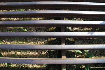Parallel metal bars in a cattle grid.