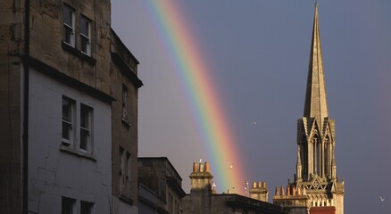 Background with rainbow over the buildings of Bath in the united kingdom.