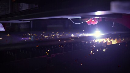 Metal machining with sparks on CNC maching. Laser cutting on the machine. laser cutting.