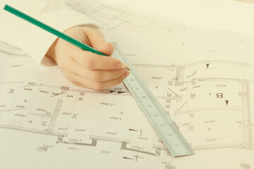 Architecture and construction. An architect draws a plan in an architectural Studio at a Desk