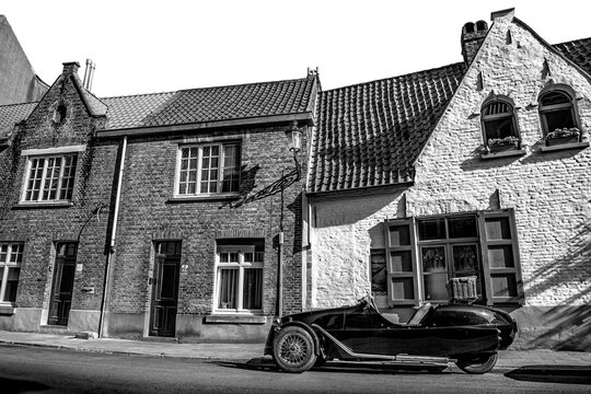 A vintage car and old houses in Bruges
