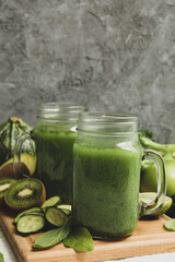 Concept of healthy food with smoothie, vegetables and fruits on wooden table