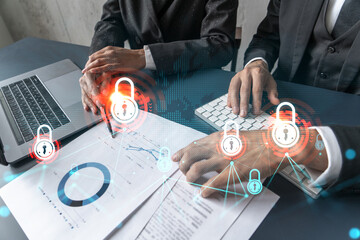Man and woman working together on securitization of information of project. Blue icon infographic lock hologram. Concept of datum safety. Double exposure.