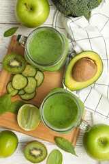 Concept of healthy food with smoothie, vegetables and fruits on wooden table