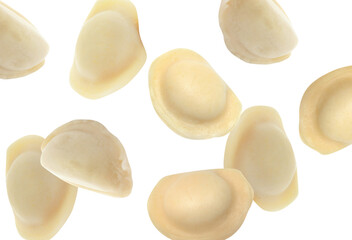 Many tasty dumplings falling on white background