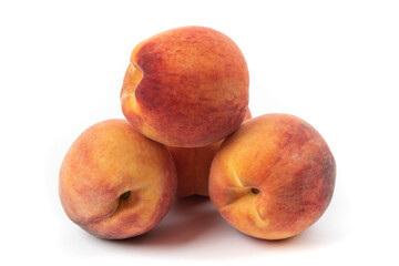 a pile of 4 fresh peaches isolated on white