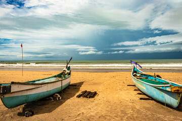 sea shore with boats and amazing sky at morning from flat angle