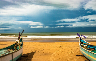 sea shore with boats and amazing sky at morning from flat angle