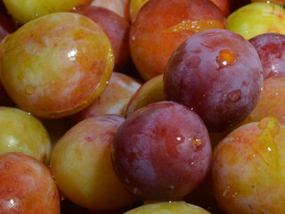 the texture of ripe plum in bulk, early fruits fruits