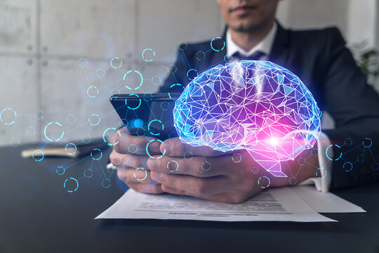 Businessman in office working with Smartphone, Brain hologram to optimize the process, typing phone. Double exposure.