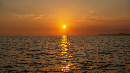 Beautiful abstract unfocused sunset over the sea. Blurry background for the screen saver. beautiful Wallpaper.