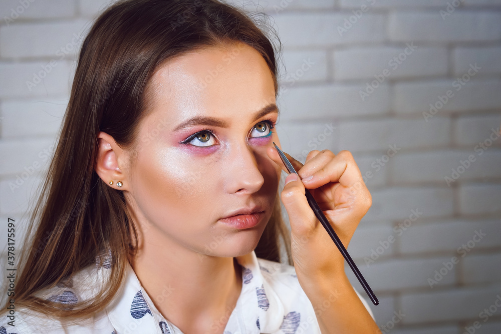 Wall mural the process of gentle makeup for a beautiful girl photo series