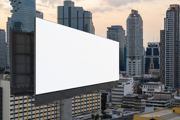 Blank white road billboard with Bangkok cityscape background at sunset. Street advertising poster, mock up, 3D rendering. Side view. The concept of marketing communication to promote or sell idea.