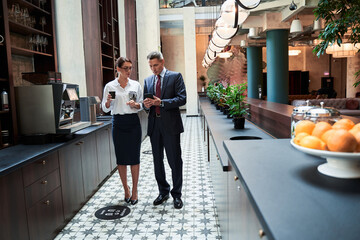 Business colleagues talking during coffee break