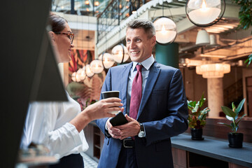 Close up shot of businesswoman and businessman on coffee break