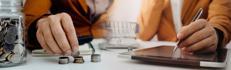 businesswoman hand using smart phone,mobile p payments online shopping,omni channel,digital tablet docking keyboard computer at office in sun light