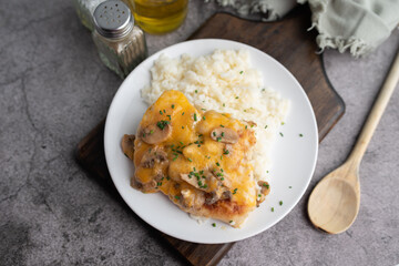 Chicken Lombardy made with five cheese and mushrooms over white rice 